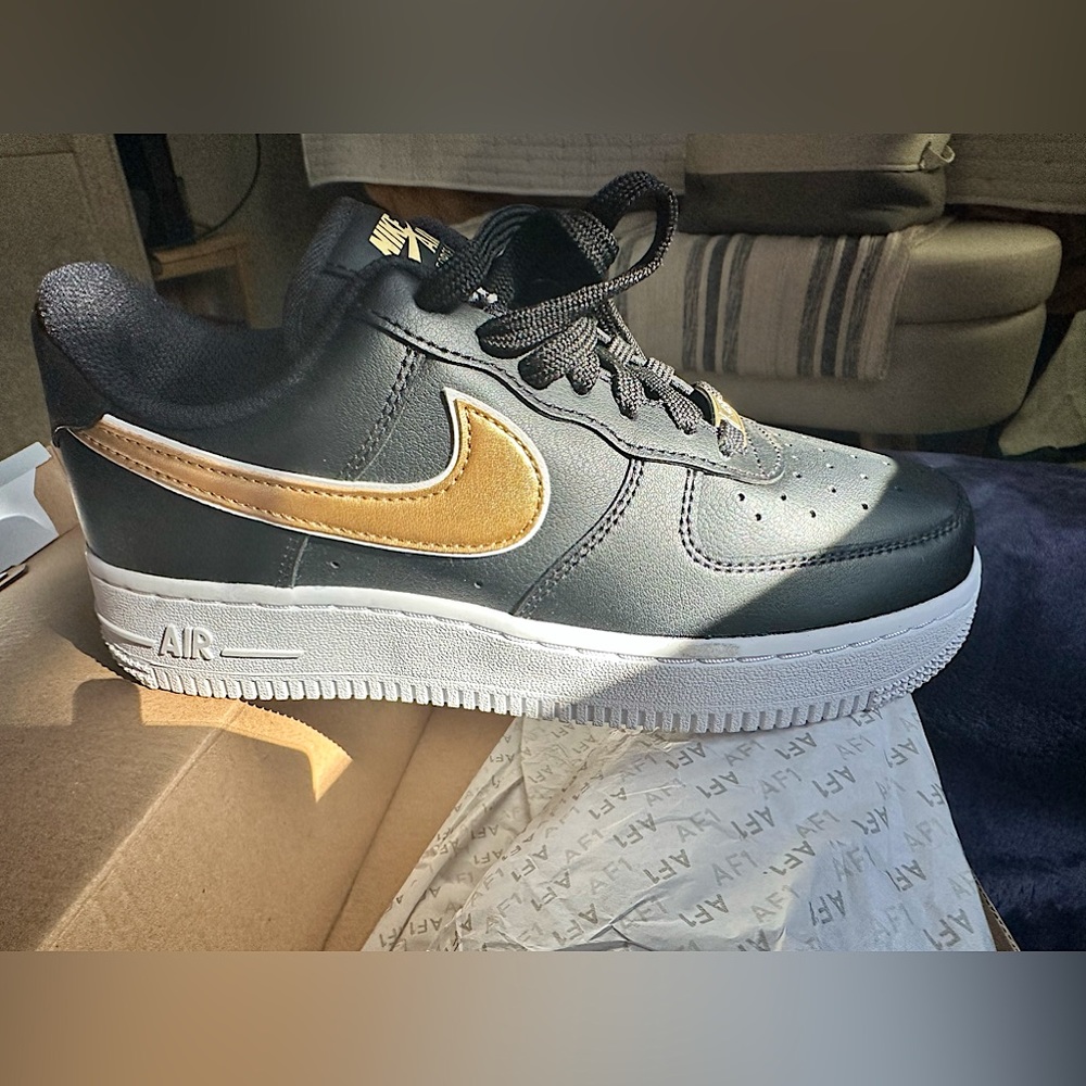Nike Air Force one-limited edition black with gold. Never worn, original box